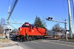 The 24 shoving the Polar Express train across S. Jefferson Road back toward the Whippany Railway Museum